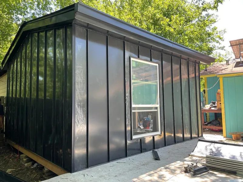 Black standing seam metal wall panels for Roof Inspection in Huron